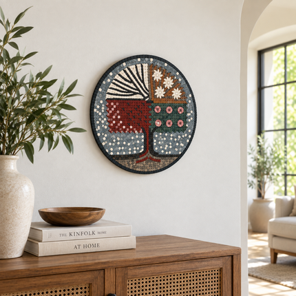 Round stone mosaic wall art: seasonal tree with red, green, and tan accents.