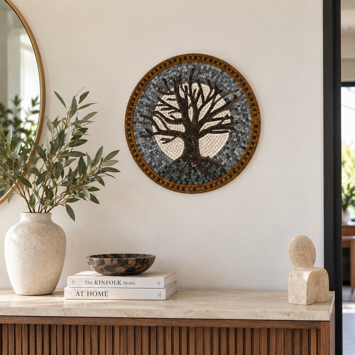 Round stone mosaic wall art with tree design in gray, black, and gold border.