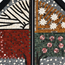 Close-up of stone mosaic panels with orange, red, green, and pink flower details in frames