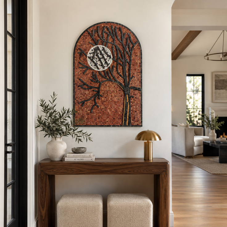 Arched stone mosaic wall art featuring an orange tree, black branches, and a white moon