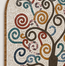 Close-up stone mosaic tree pattern with circular tile swirls in teal, red, and tan