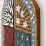 Handmade stone mosaic wall art with arched tree scene, blue border, and circular flower tiles