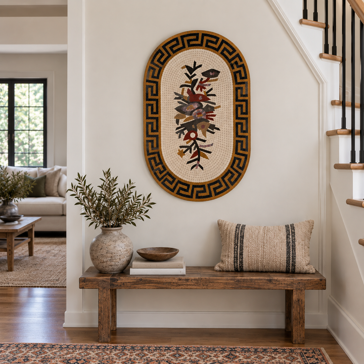 Oval stone mosaic wall art with Greek key border and floral bird motif in warm tones