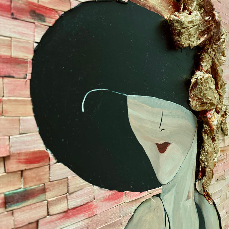 Close-up of the woman’s face and gold hat with black headpiece in mosaic portrait